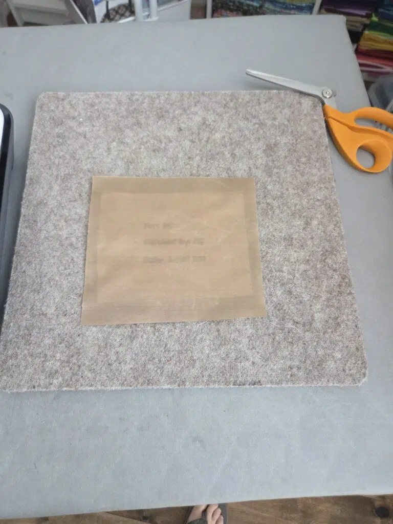 put heat resistant sheet over label top