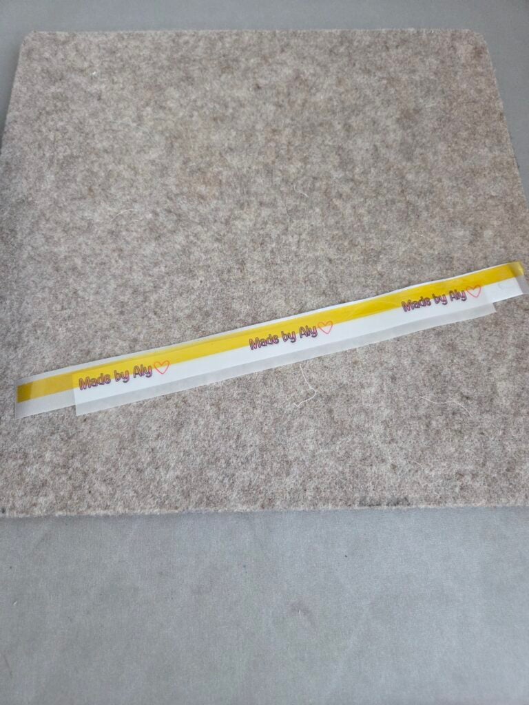use tape to stick dtf film on ribbon